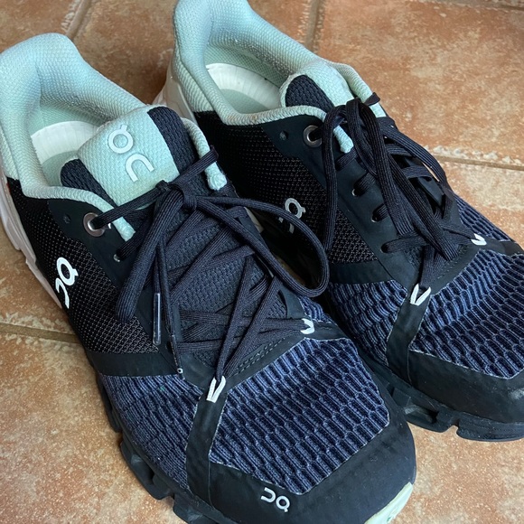 On Running Shoes On Cloud Helion Running Shoe Primarily Black Navy And Mint With White Sole